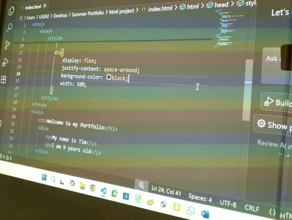 Children learning HTML coding in class